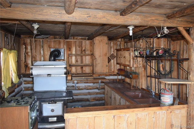 interior space featuring rustic walls, sink, and wood ceiling