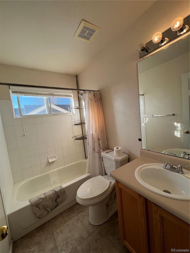 full bathroom featuring toilet, tile patterned floors, vanity, and shower / tub combo with curtain