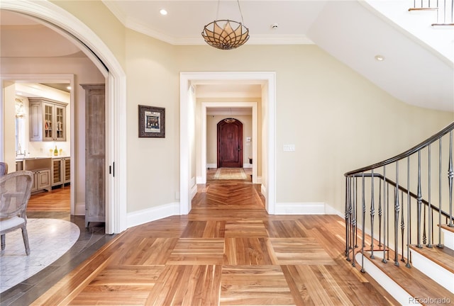 corridor featuring crown molding and parquet flooring