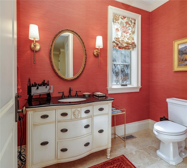 bathroom with vanity and toilet