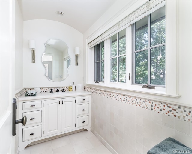 bathroom featuring tile walls, vanity, and tile patterned floors