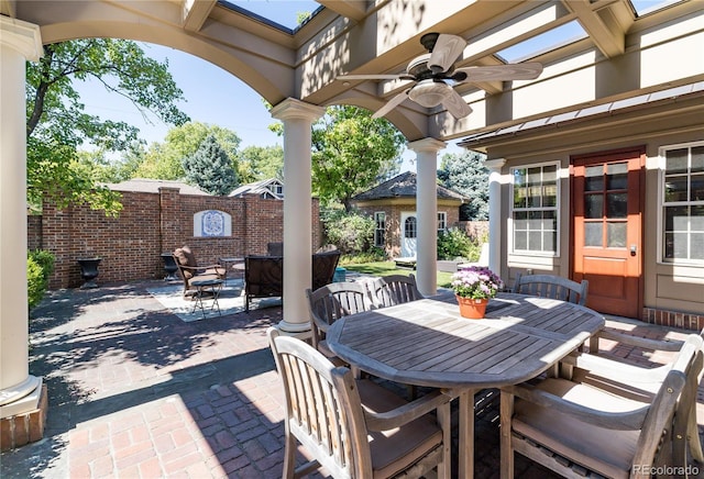 view of patio featuring an outbuilding and ceiling fan