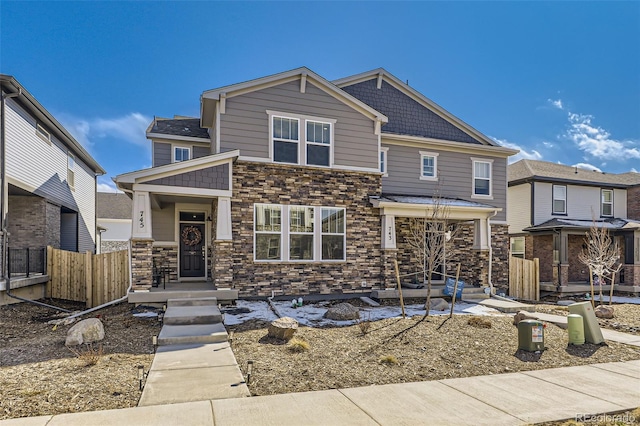 745 N Tempe St, Aurora, CO 80018 - craftsman-style house featuring fence and stone siding