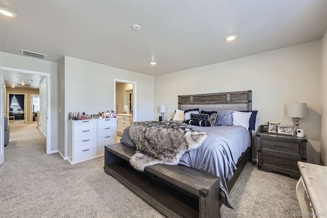 745 N Tempe St, Aurora, CO 80018 - bedroom with recessed lighting, light colored carpet, ensuite bathroom, and visible vents