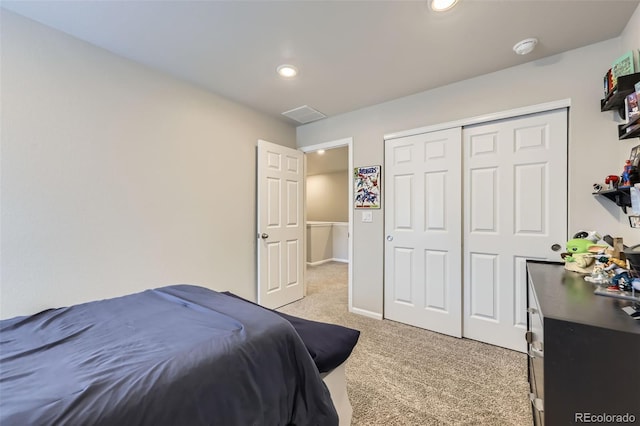 745 N Tempe St, Aurora, CO 80018 - bedroom with recessed lighting, baseboards, light colored carpet, and a closet