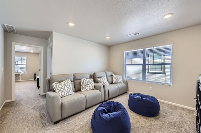 745 N Tempe St, Aurora, CO 80018 - living room with baseboards, light colored carpet, recessed lighting, and visible vents