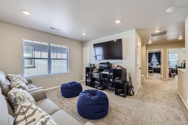 745 N Tempe St, Aurora, CO 80018 - living area featuring carpet floors, recessed lighting, and visible vents