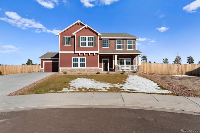 view of front of home featuring a porch and a garage