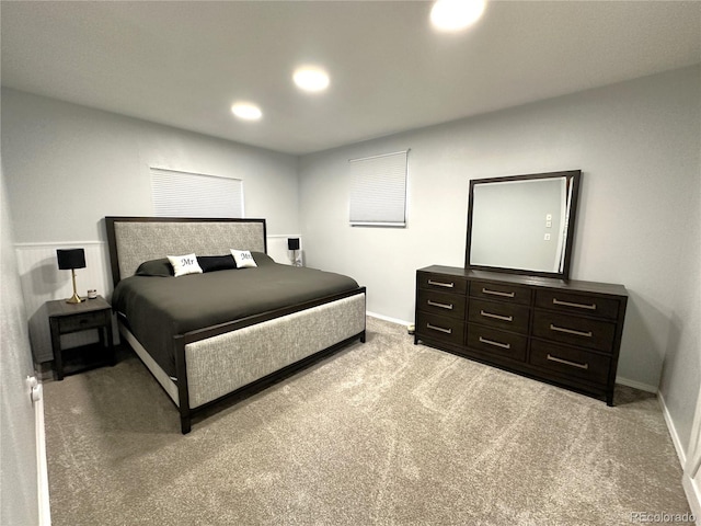 bedroom with recessed lighting, baseboards, and light colored carpet