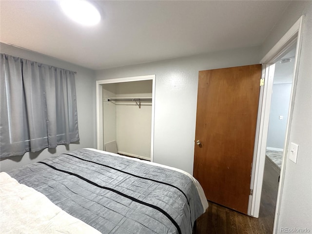 bedroom featuring a closet and wood finished floors