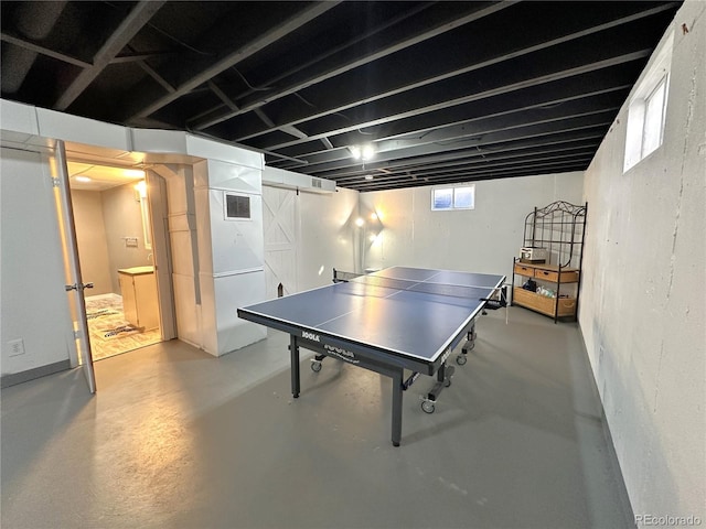 game room featuring finished concrete flooring and visible vents