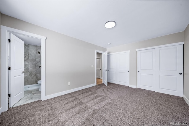 4064 S Olathe Ct, Aurora, CO 80013 - unfurnished bedroom with multiple closets, carpet flooring, and connected bathroom