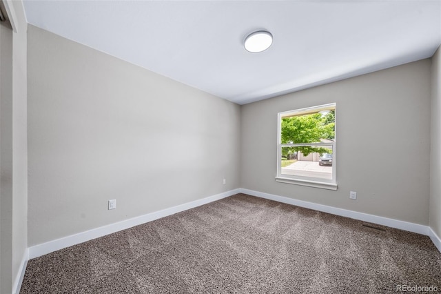4064 S Olathe Ct, Aurora, CO 80013 - carpeted spare room with baseboards