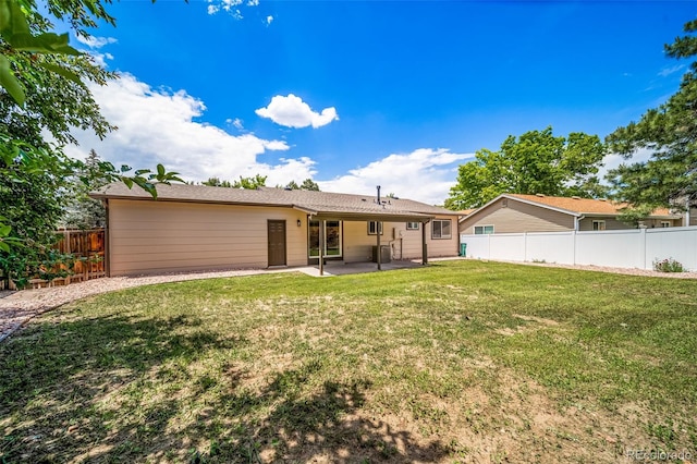 4064 S Olathe Ct, Aurora, CO 80013 - back of property with a patio and a fenced backyard