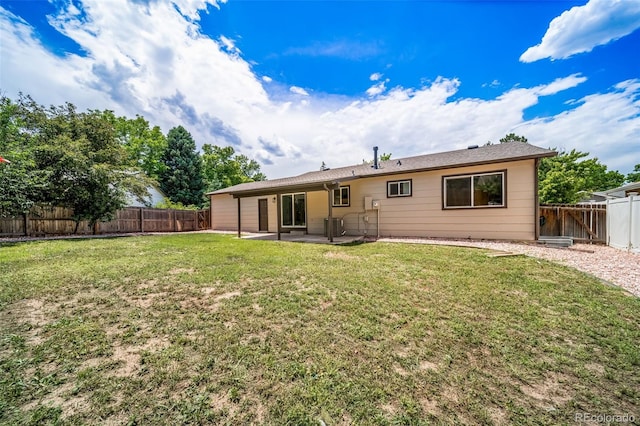 4064 S Olathe Ct, Aurora, CO 80013 - back of property with a patio area and a fenced backyard