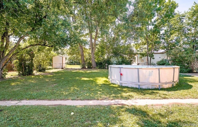 view of yard with an outdoor pool