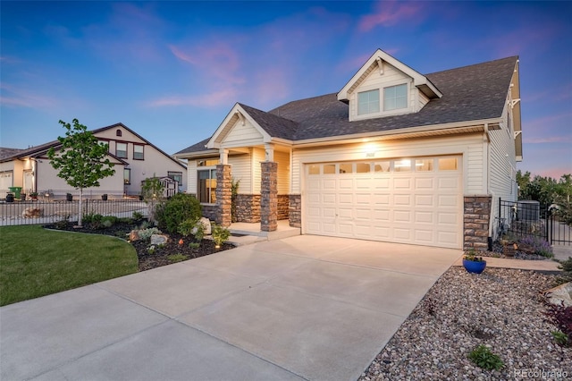 19688 E 52nd Ave, Denver, CO 80249 - view of front of house featuring stone siding, concrete driveway, a garage, fence, and a shingled roof