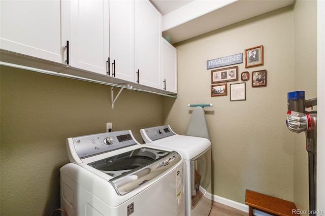 19688 E 52nd Ave, Denver, CO 80249 - washroom featuring independent washer and dryer, cabinet space, and baseboards