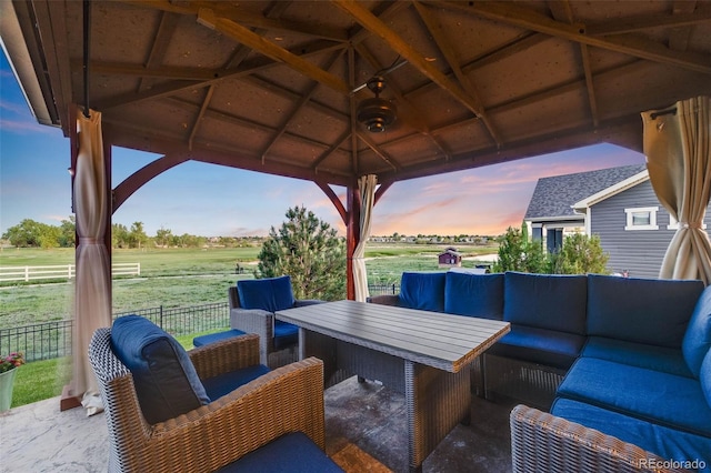 19688 E 52nd Ave, Denver, CO 80249 - view of patio featuring outdoor lounge area, a gazebo, and fence