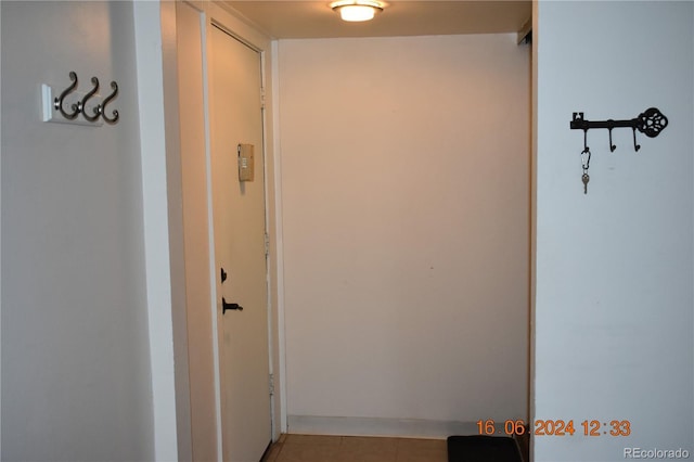 hallway featuring light tile patterned flooring