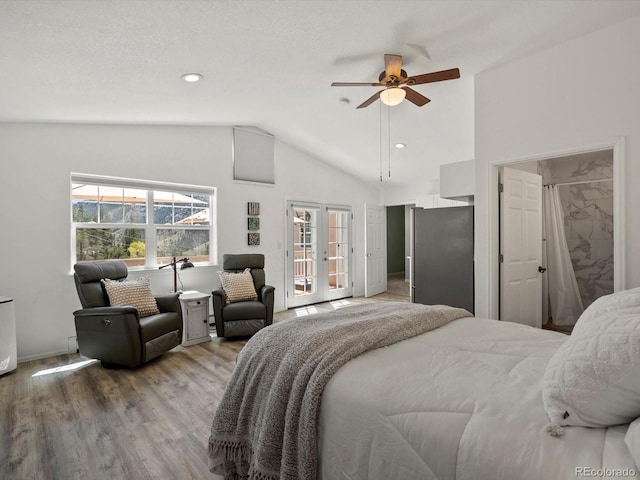 2571 SW Grapevine Rd, Idledale, CO 80453 - bedroom featuring lofted ceiling, light wood finished floors, freestanding refrigerator, french doors, and baseboards