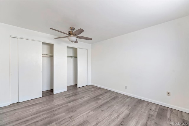 unfurnished bedroom with ceiling fan and light wood-type flooring