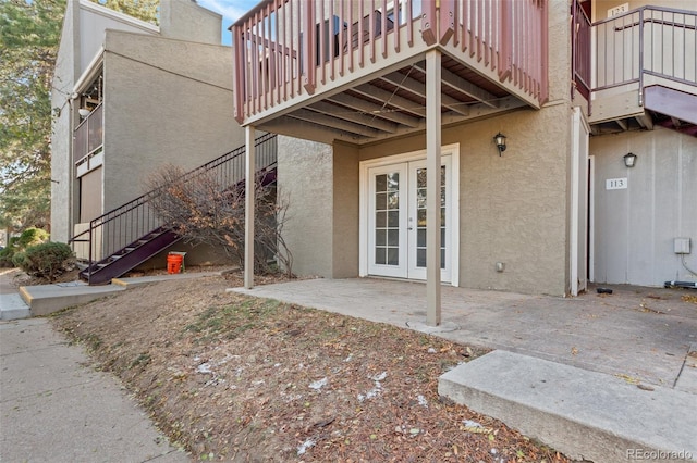 property entrance with french doors and a patio area