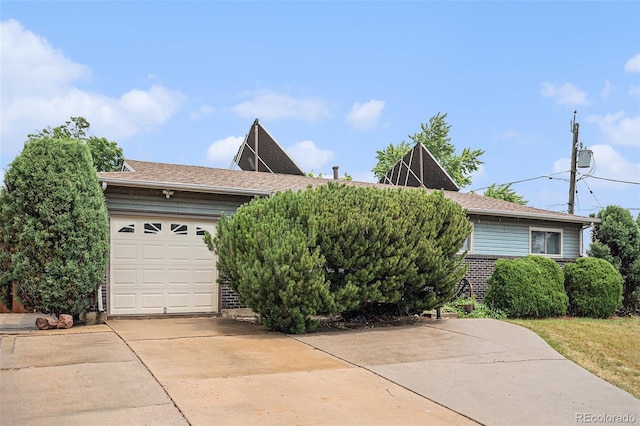 9590 Lowell Blvd, Westminster, CO 80031 - view of front of house featuring driveway and a garage