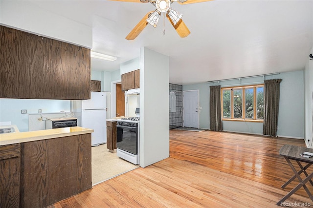 9590 Lowell Blvd, Westminster, CO 80031 - kitchen featuring white appliances, light wood finished floors, light countertops, a ceiling fan, and dark brown cabinets
