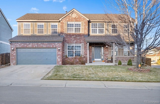 view of front facade with a garage and a front lawn