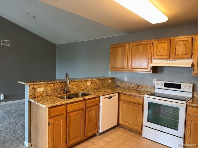 12304 W Cross Dr Unit 304, Littleton, CO 80127 - kitchen featuring white appliances, under cabinet range hood, a peninsula, light stone countertops, and brown cabinetry