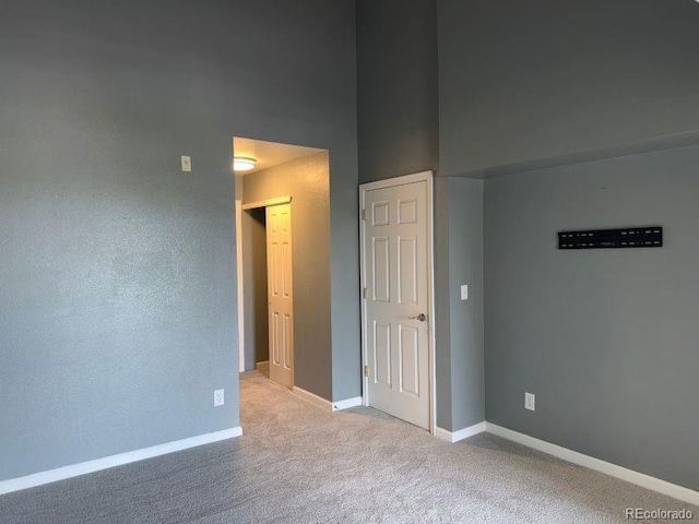 12304 W Cross Dr Unit 304, Littleton, CO 80127 - unfurnished bedroom featuring carpet flooring and baseboards