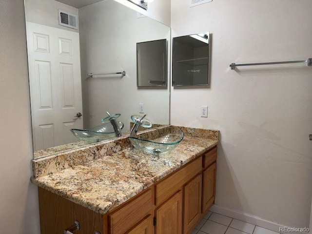 12304 W Cross Dr Unit 304, Littleton, CO 80127 - bathroom featuring vanity and tile patterned flooring