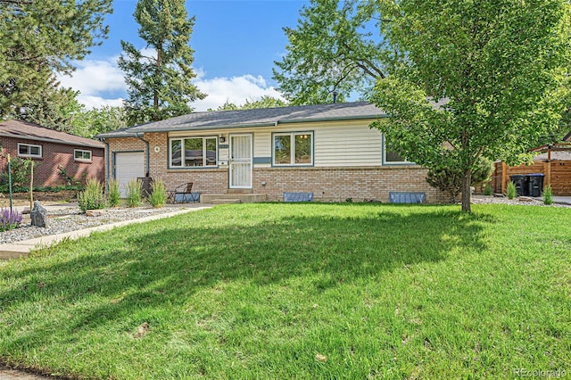 single story home featuring brick siding, an attached garage, and a front lawn