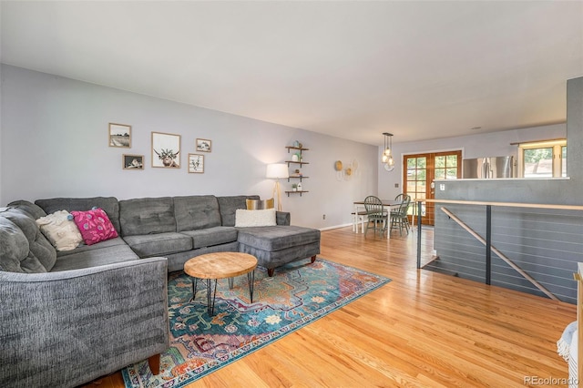 living room featuring baseboards and wood finished floors