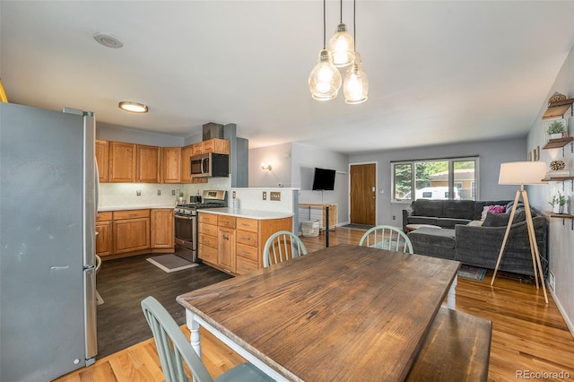 dining space featuring dark wood finished floors and baseboards