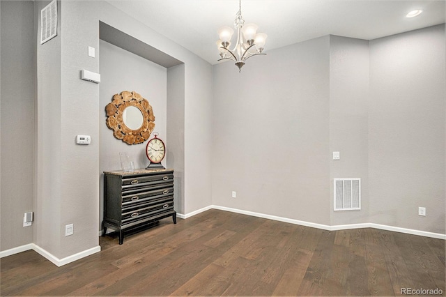 24943 E Phillips Pl, Aurora, CO 80016 - unfurnished room with dark wood-type flooring, baseboards, and a chandelier