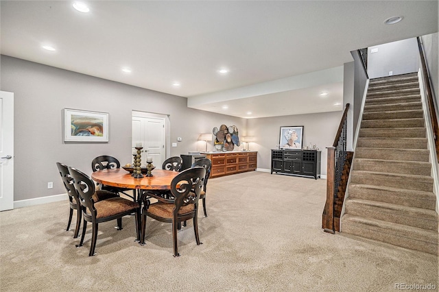 24943 E Phillips Pl, Aurora, CO 80016 - dining area with baseboards, stairway, light carpet, and recessed lighting