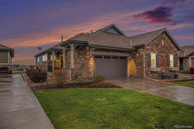 24943 E Phillips Pl, Aurora, CO 80016 - ranch-style home with roof with shingles, a yard, a garage, concrete driveway, and stone siding