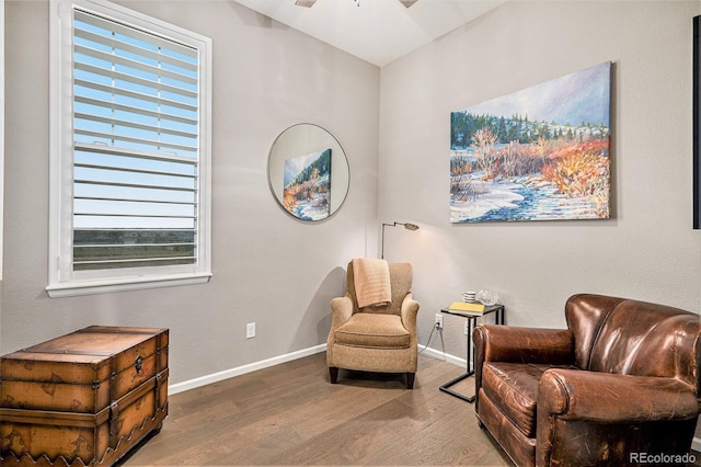 24943 E Phillips Pl, Aurora, CO 80016 - sitting room with wood finished floors, baseboards, plenty of natural light, and a ceiling fan