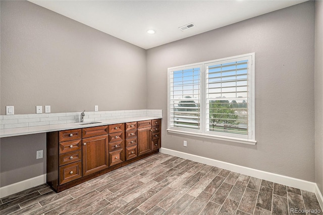 24943 E Phillips Pl, Aurora, CO 80016 - unfurnished office with baseboards, a sink, wood finish floors, and recessed lighting