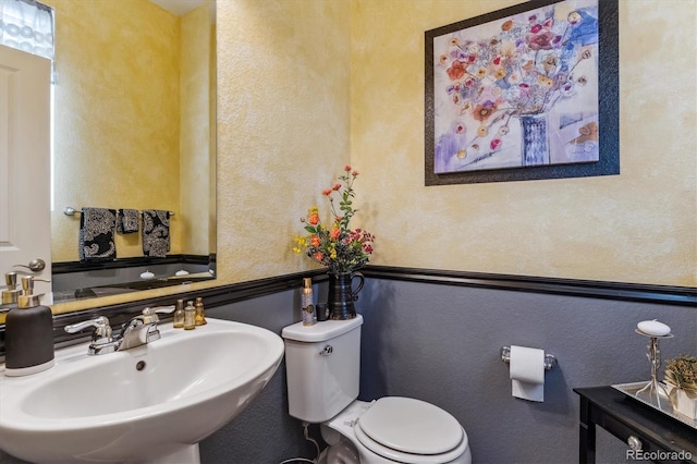 bathroom with sink and toilet