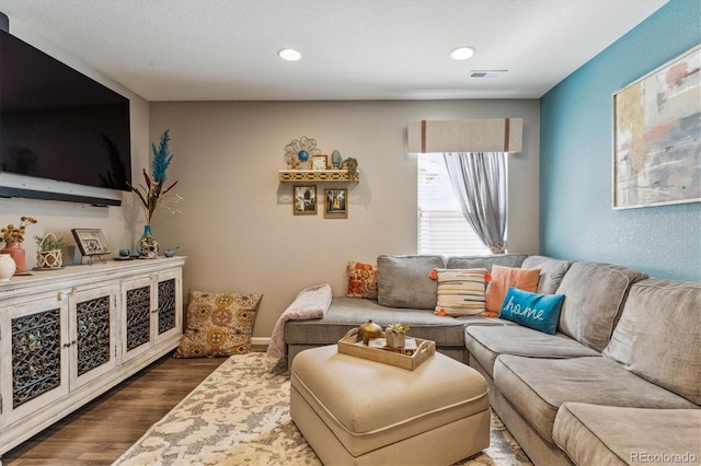 living room with dark hardwood / wood-style flooring