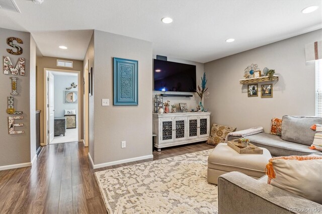 living room with dark hardwood / wood-style floors