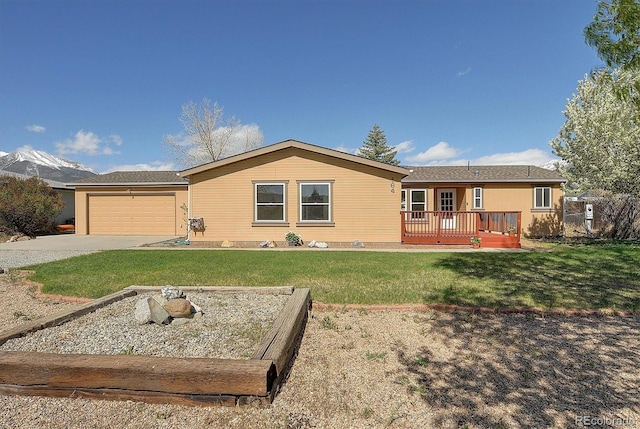 164 Robert Dr, Buena Vista, CO 81211 - single story home featuring a front yard, concrete driveway, an attached garage, and a deck