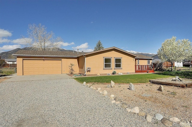164 Robert Dr, Buena Vista, CO 81211 - ranch-style home featuring driveway, a garage, a front lawn, and a mountain view