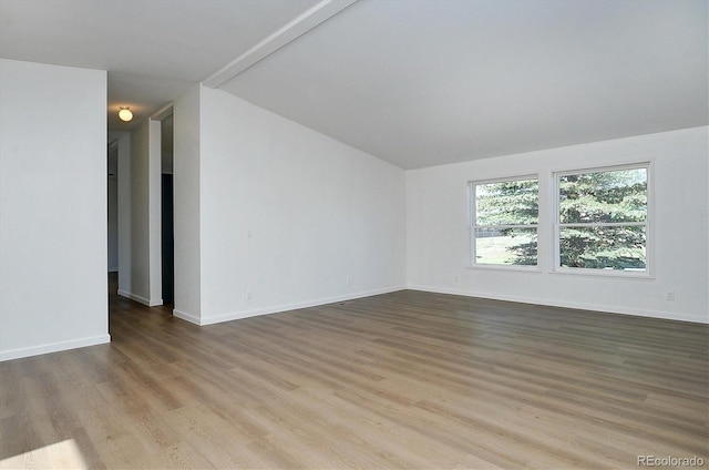 164 Robert Dr, Buena Vista, CO 81211 - unfurnished room featuring lofted ceiling, wood finished floors, and baseboards