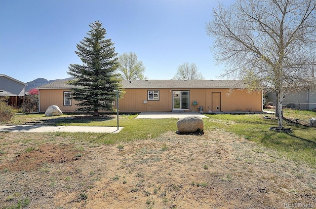 164 Robert Dr, Buena Vista, CO 81211 - back of house with a lawn and a patio area