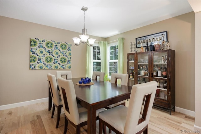 16268 E Belleview Dr, Centennial, CO 80015 - dining room featuring a chandelier and light wood-style floors