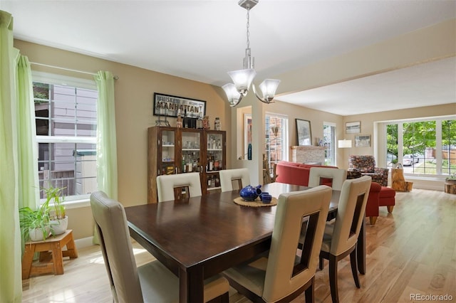 16268 E Belleview Dr, Centennial, CO 80015 - dining space with light wood-type flooring and a chandelier